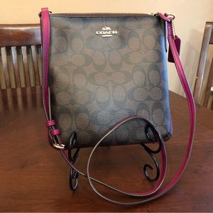 COACH Signature North/South Crossbody Brown w/fuchsia details.PRISTINE CONDITION